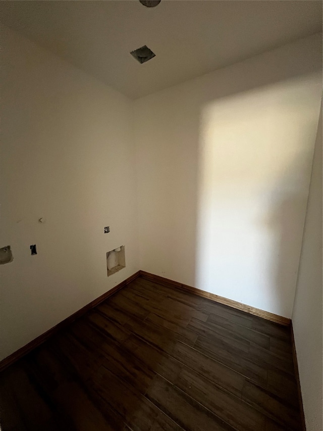 unfurnished room featuring dark hardwood / wood-style flooring