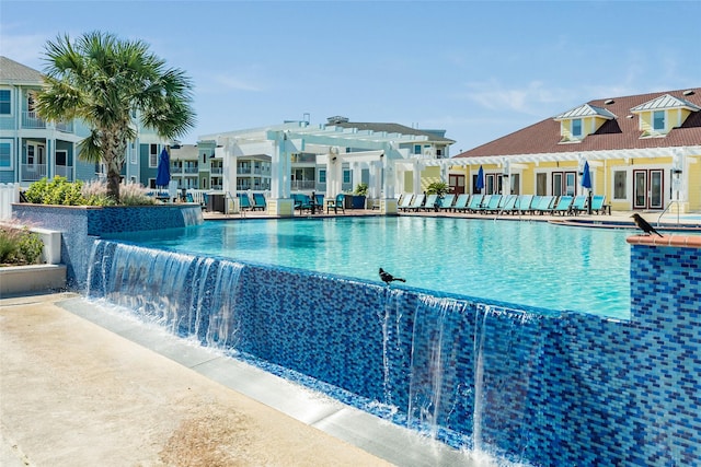 4131 Pointe W Dr Unit 302, Galveston, TX 77554 - community pool with a pergola and a patio