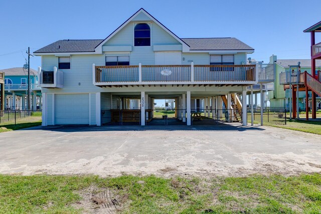 rear view of property with a garage