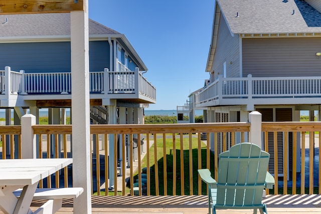 wooden terrace with a yard