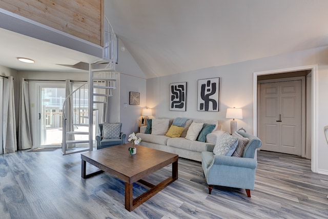 living room with high vaulted ceiling and wood-type flooring