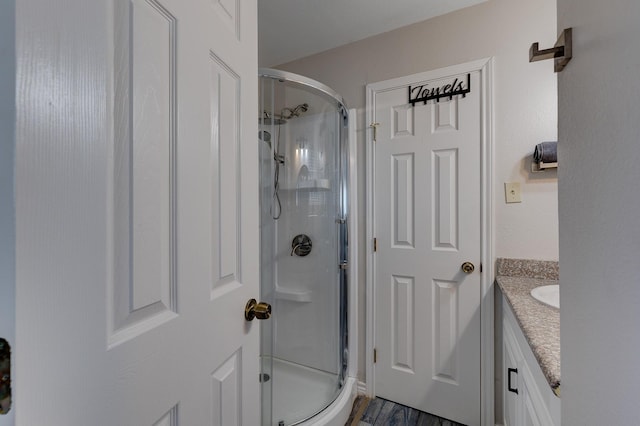 2332 Martinique, Crystal Beach, TX 77650 - full bathroom featuring a shower stall, vanity, and wood finished floors
