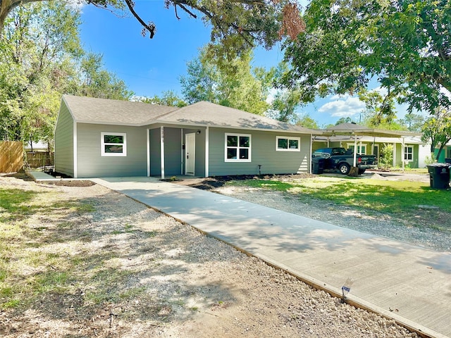 ranch-style home with a carport