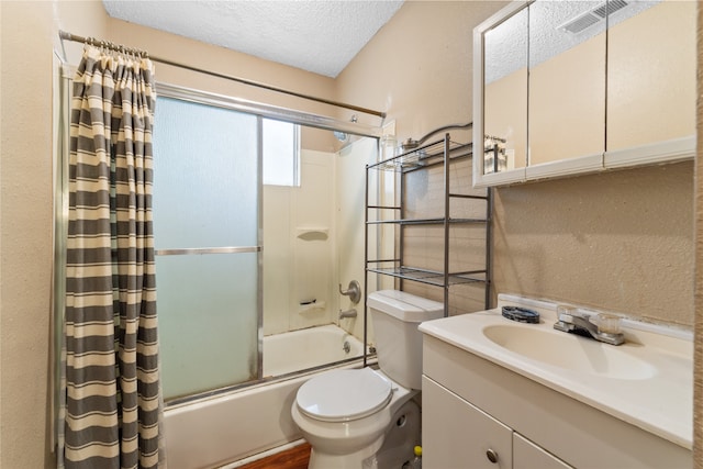 full bathroom featuring shower / tub combo, a textured ceiling, vanity, and toilet