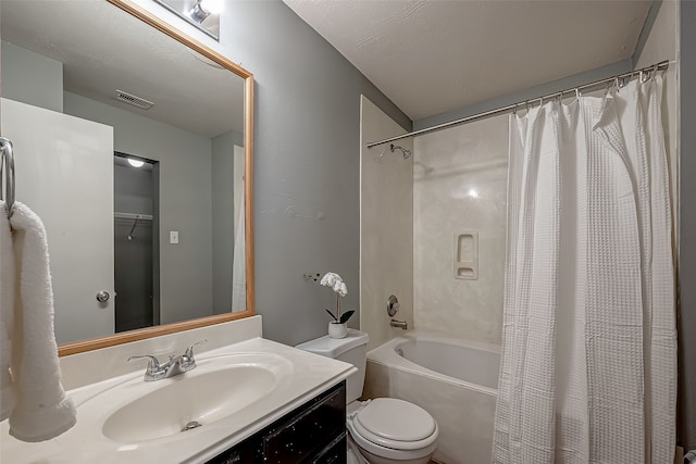 full bathroom with shower / bath combination with curtain, vanity, toilet, and a textured ceiling