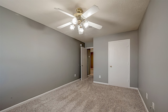 unfurnished bedroom featuring carpet flooring and ceiling fan