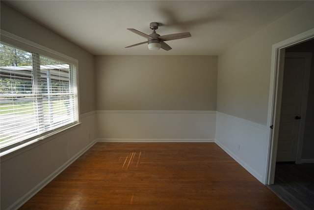 unfurnished room featuring ceiling fan and dark hardwood / wood-style floors