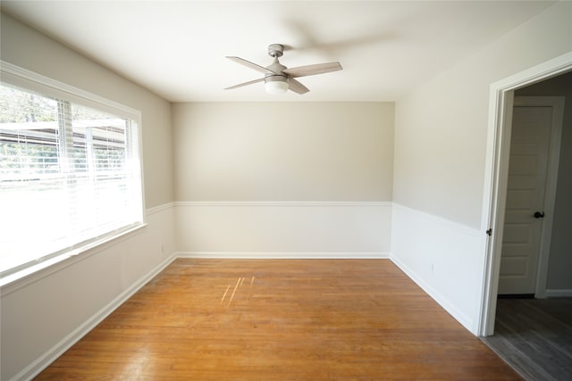 unfurnished room featuring ceiling fan and hardwood / wood-style floors