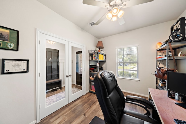 office with wood-type flooring, ceiling fan, and french doors