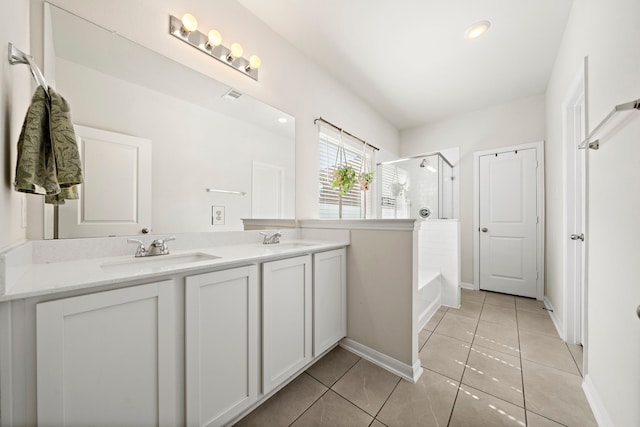 bathroom with independent shower and bath, tile patterned flooring, and vanity