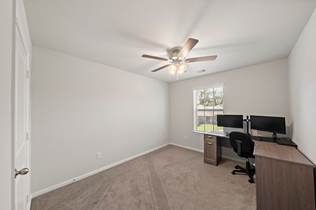 office area featuring ceiling fan and light colored carpet