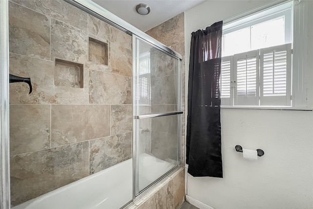 bathroom with enclosed tub / shower combo