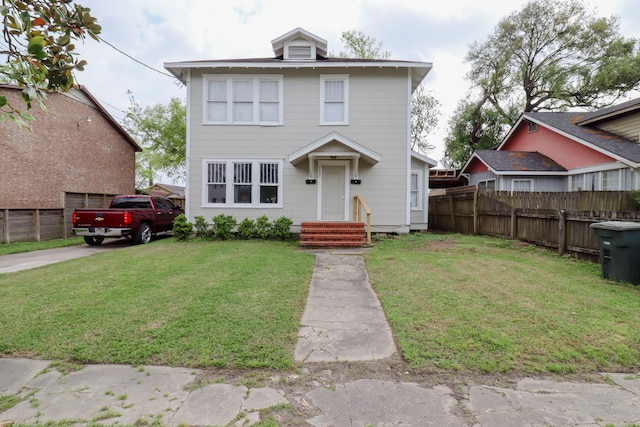 view of front of property with a front lawn