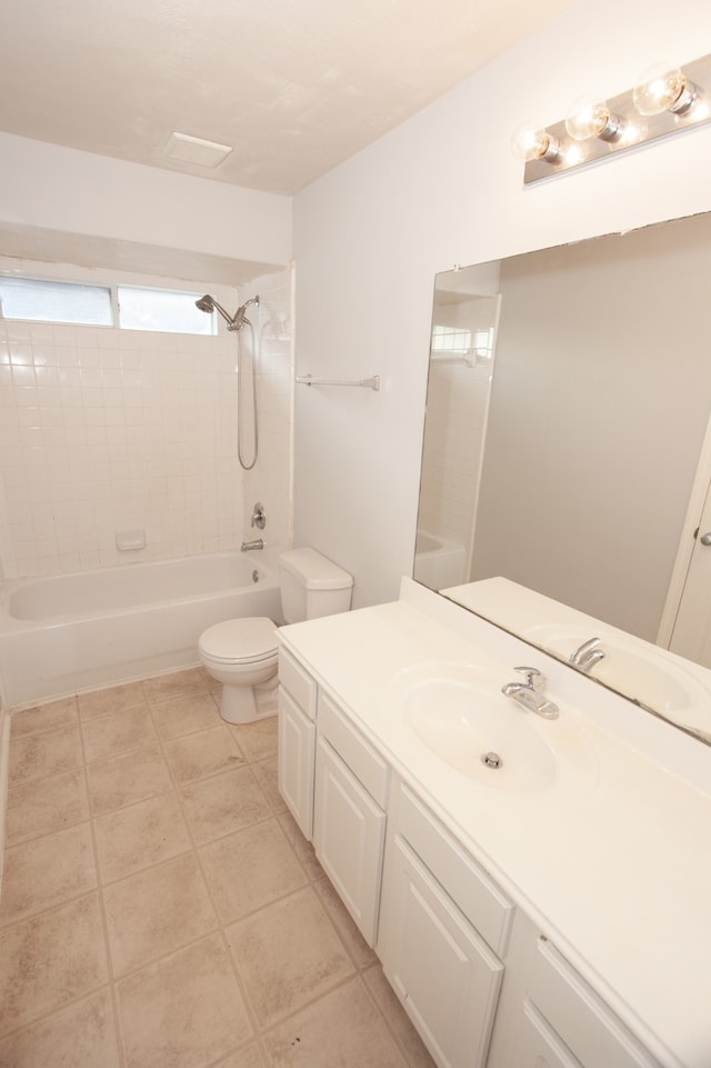 full bathroom featuring vanity, toilet, tile patterned floors, and tiled shower / bath