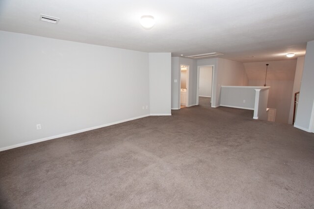 empty room featuring dark carpet