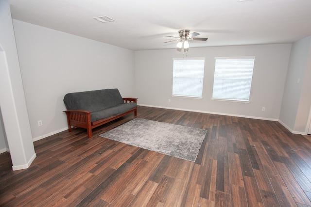 sitting room featuring ceiling fan and dark hardwood / wood-style flooring