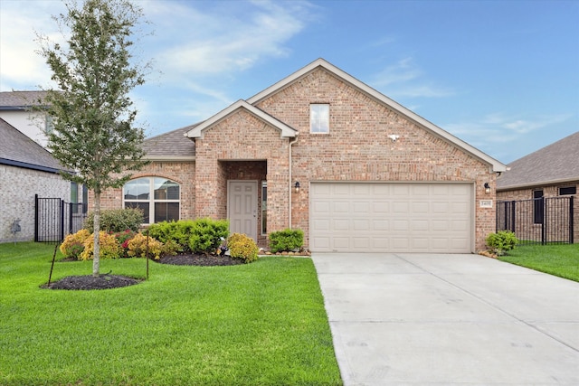 view of front of property with a garage and a front lawn