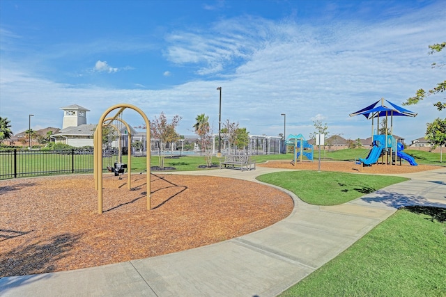 view of playground with a lawn