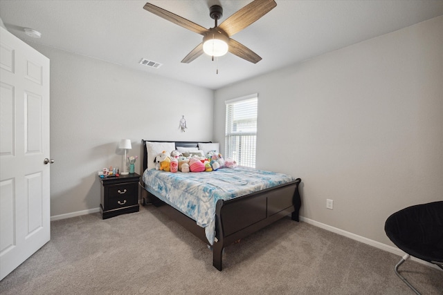 bedroom featuring light colored carpet and ceiling fan