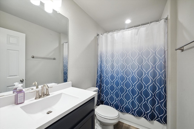 full bathroom featuring vanity, toilet, and shower / tub combo with curtain