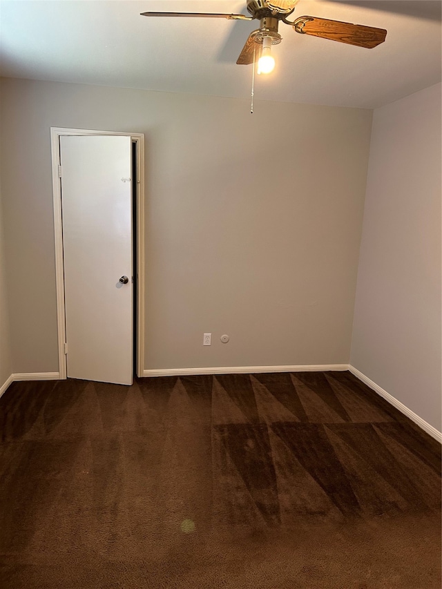 spare room with carpet and ceiling fan