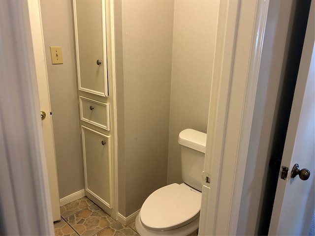 bathroom featuring tile patterned flooring and toilet