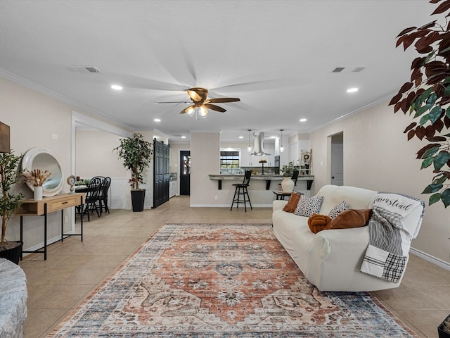 living room featuring light tile patterned floors, ceiling fan, and ornamental molding