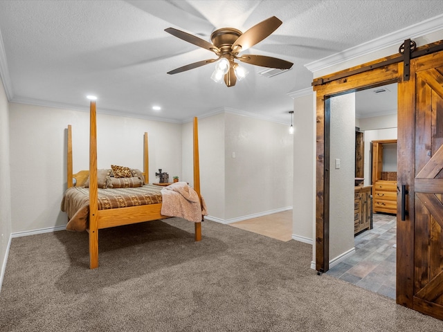 carpeted bedroom featuring a textured ceiling, ceiling fan, a barn door, and crown molding