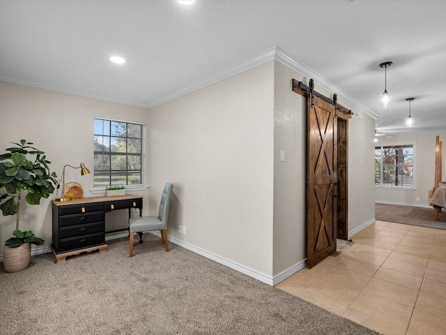 carpeted home office featuring a barn door and ornamental molding