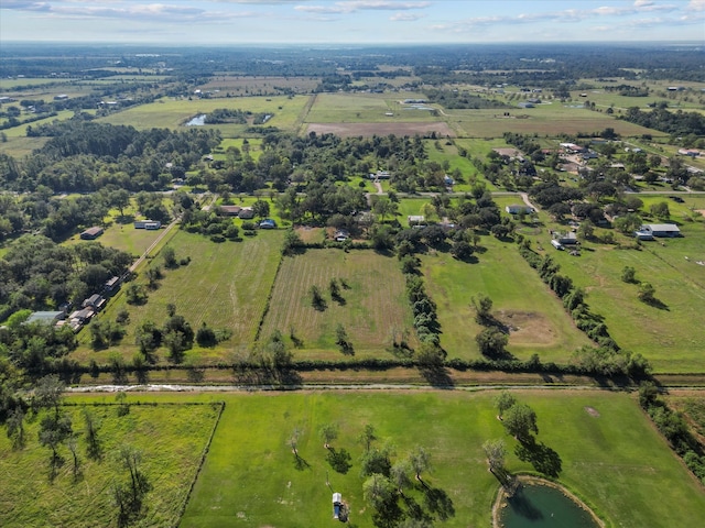 drone / aerial view featuring a rural view and a water view