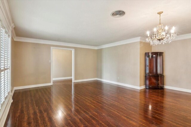 3301 Pelican St, Orange, TX 77630 - unfurnished room featuring visible vents, crown molding, wood finished floors, and an inviting chandelier