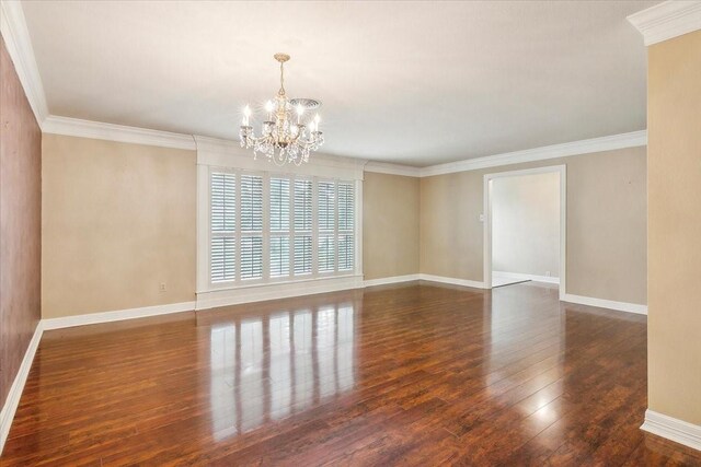 3301 Pelican St, Orange, TX 77630 - empty room featuring baseboards, crown molding, hardwood / wood-style flooring, and an inviting chandelier