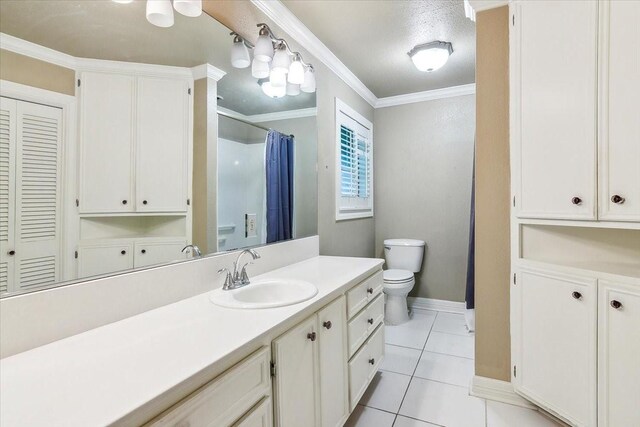 3301 Pelican St, Orange, TX 77630 - full bath with tile patterned floors, crown molding, toilet, vanity, and baseboards