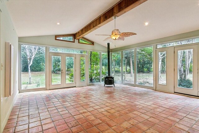 3301 Pelican St, Orange, TX 77630 - unfurnished sunroom with french doors, beamed ceiling, and a wood stove