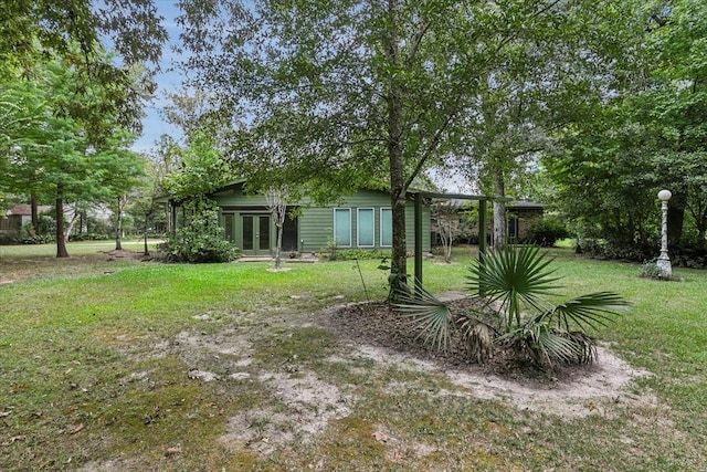 3301 Pelican St, Orange, TX 77630 - view of yard featuring french doors