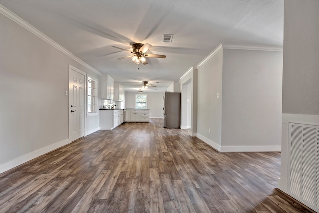 unfurnished living room with ornamental molding, wood-type flooring, and ceiling fan