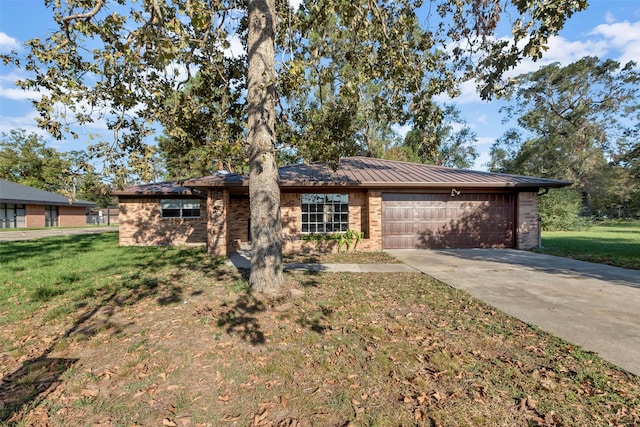 ranch-style home with a garage and a front yard