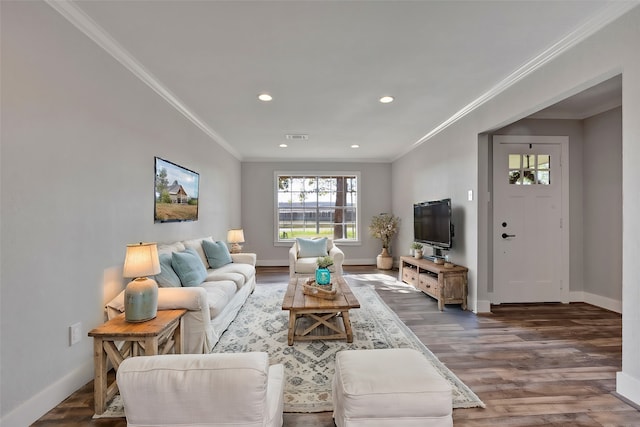 living room featuring dark hardwood / wood-style flooring and crown molding