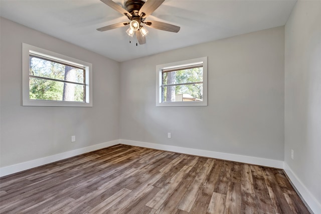 unfurnished room with ceiling fan and wood-type flooring