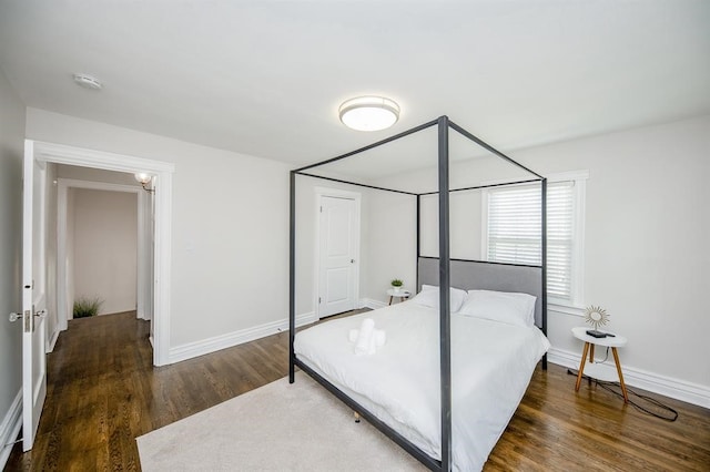 bedroom featuring dark wood-type flooring