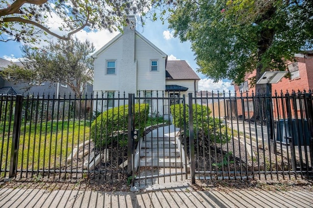 view of gate with a yard