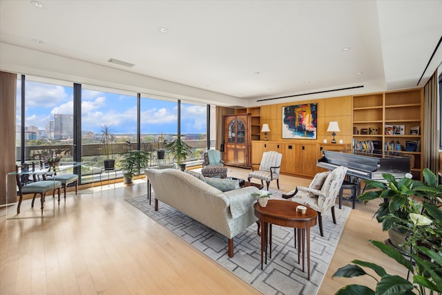 living room with light hardwood / wood-style flooring and plenty of natural light