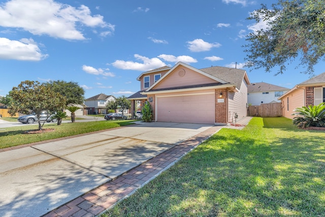 view of property featuring a front yard and a garage