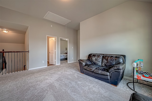 living area with lofted ceiling and light colored carpet