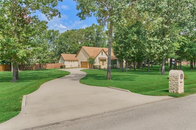 view of front facade with a garage and a front lawn