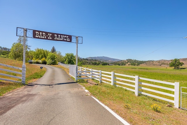 view of road featuring a rural view and a mountain view