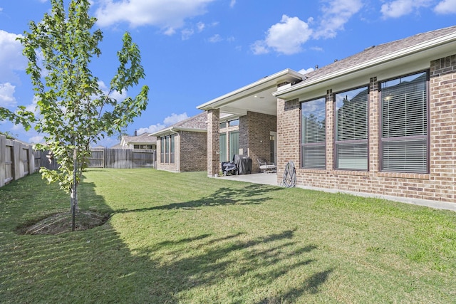 view of yard featuring a patio and a fenced backyard