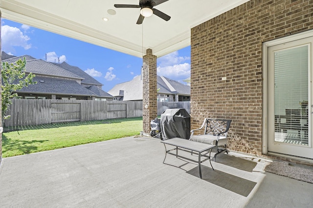 view of patio / terrace featuring a fenced backyard, a ceiling fan, and area for grilling