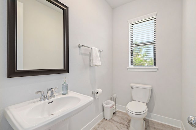 bathroom with sink and toilet