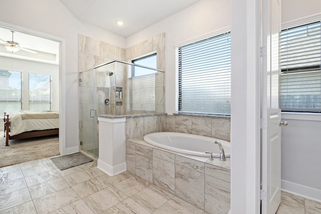 bathroom featuring ceiling fan, plus walk in shower, and a healthy amount of sunlight